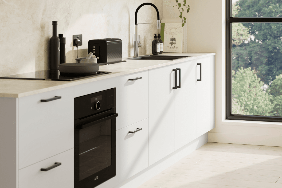 Kitchen with Ilminster Light Grey doors and black handles
