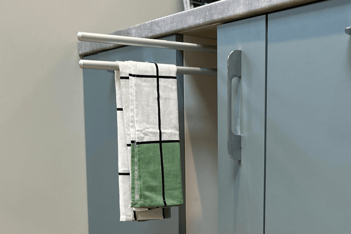Kitchen with a tray space and towel rail