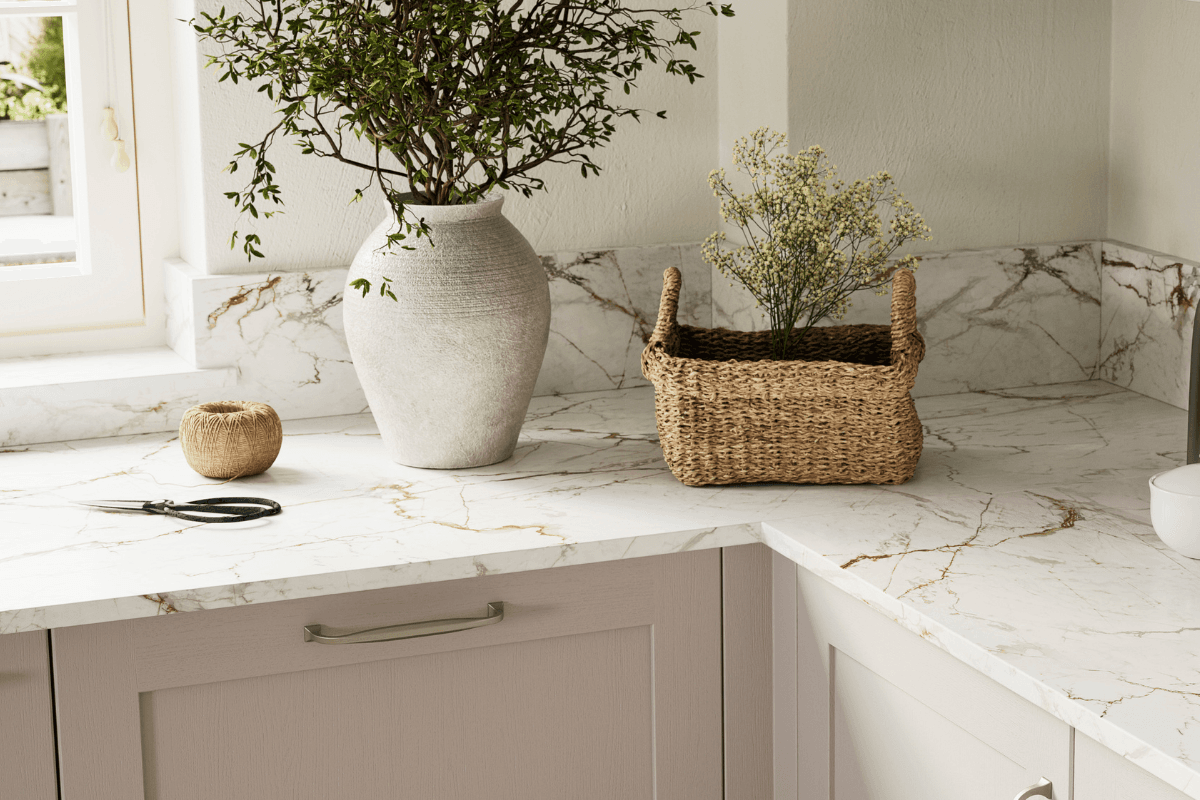Kitchen with white worktop and copper veining